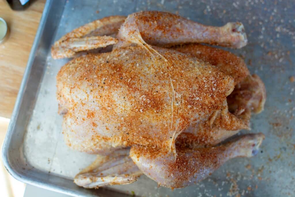a chicken with rub all over it